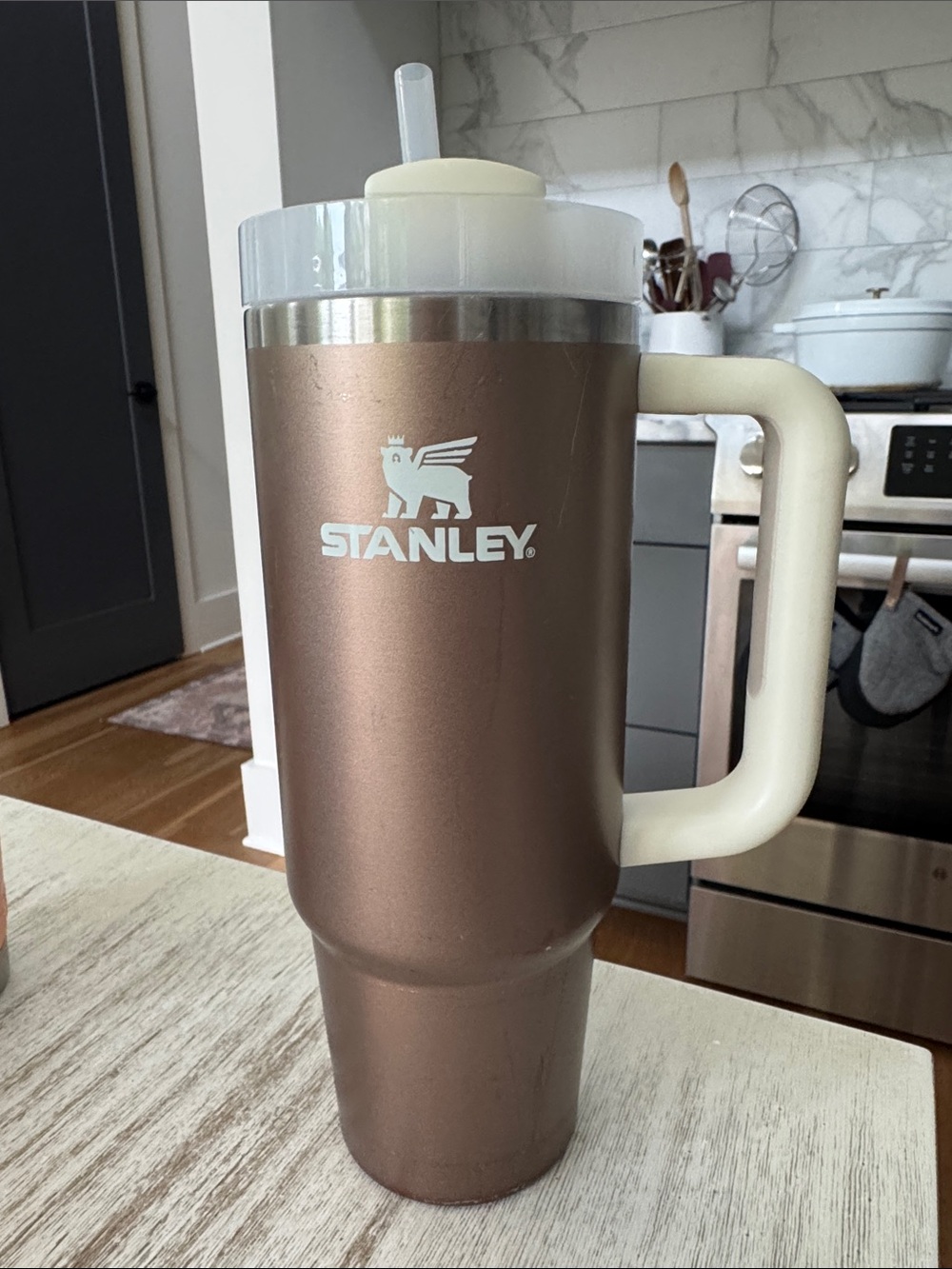 Stanley Bronze Travel Tumbler with Cream Handle and Clear Lid